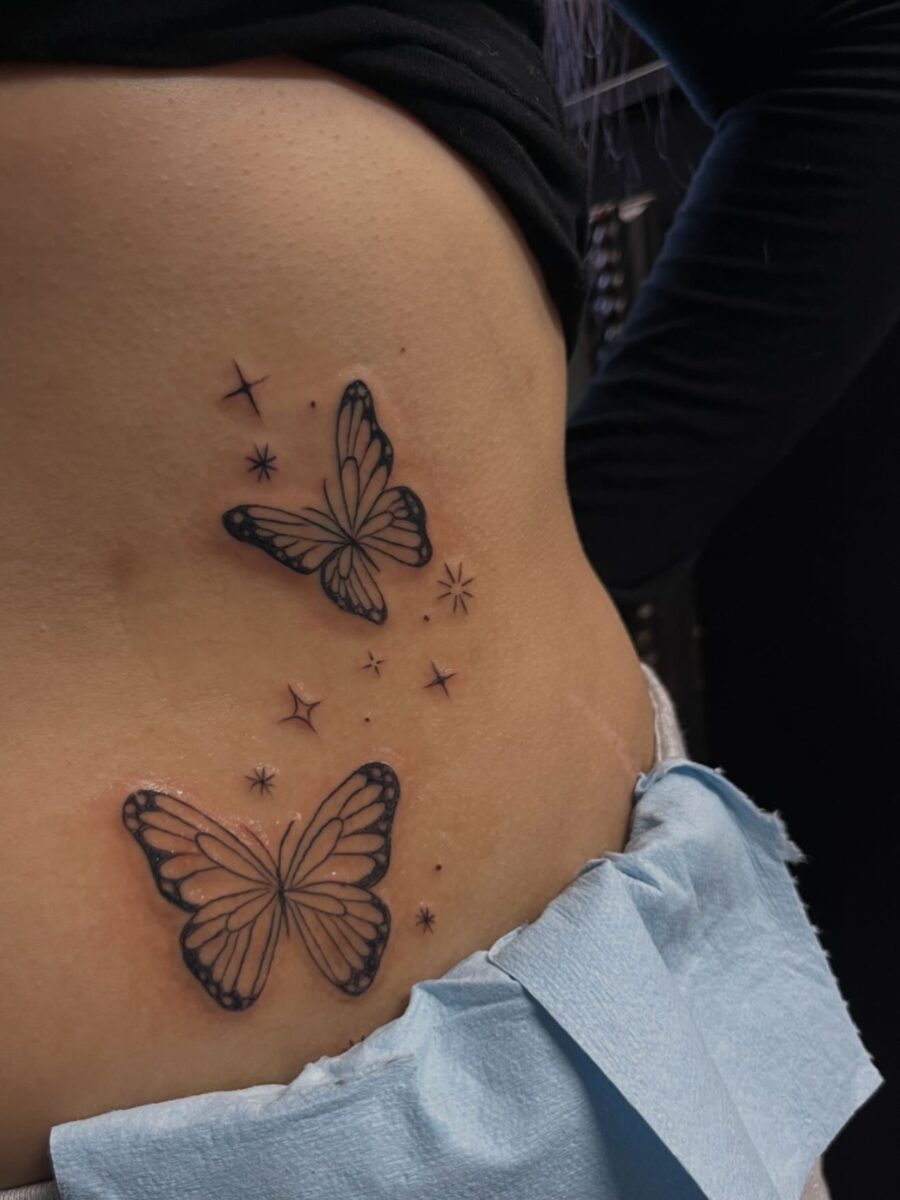 Elegant butterfly tattoos on the stomach