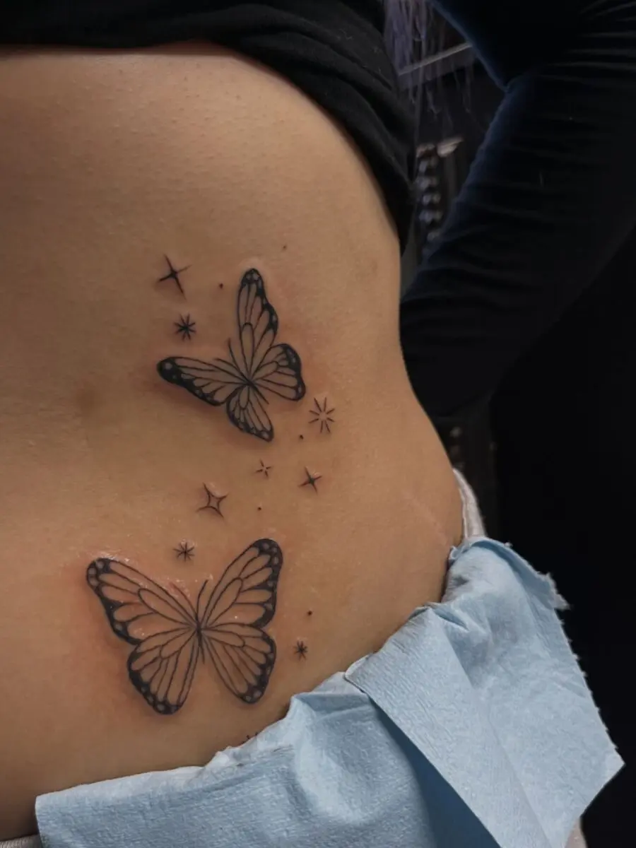 Elegant butterfly tattoos on the stomach
