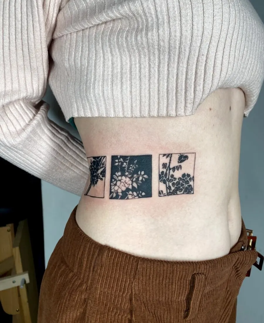 Beautiful floral stomach tattoo in three panels
