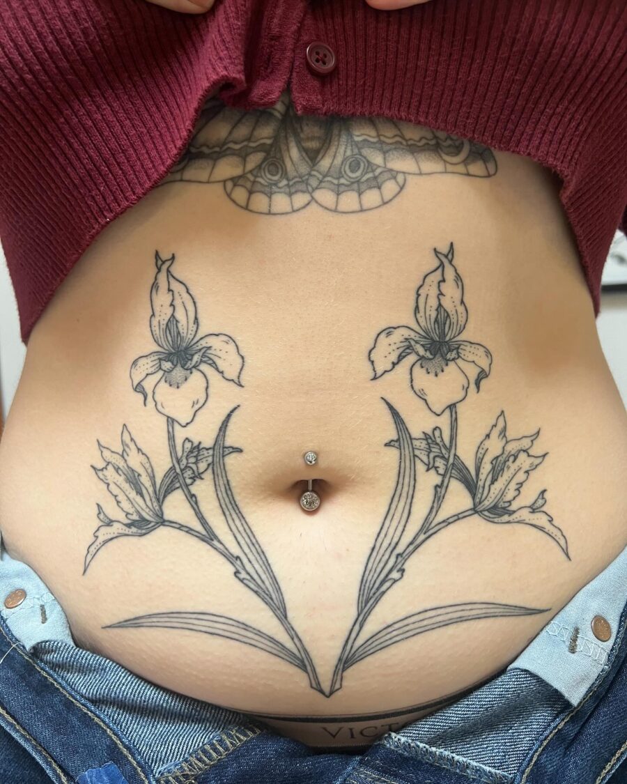 Stunning floral stomach tattoo with belly ring