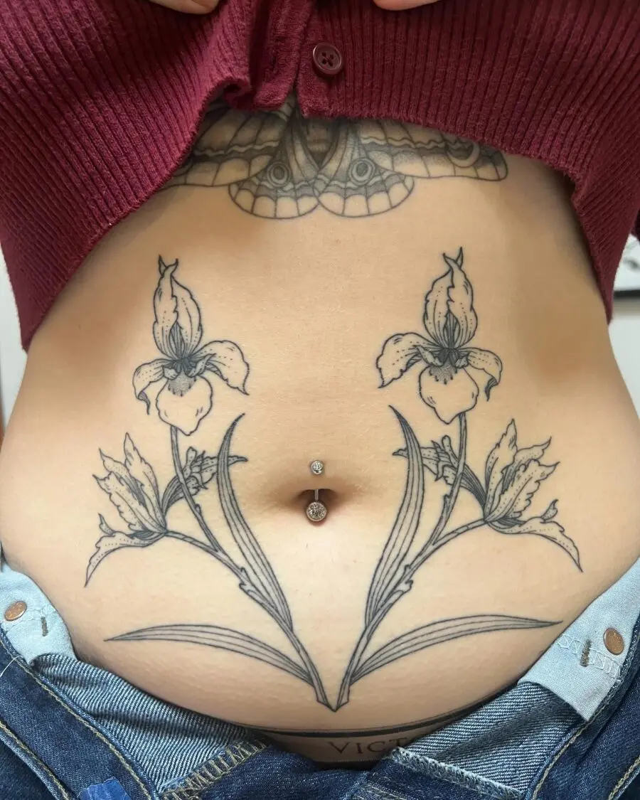 Stunning floral stomach tattoo with belly ring