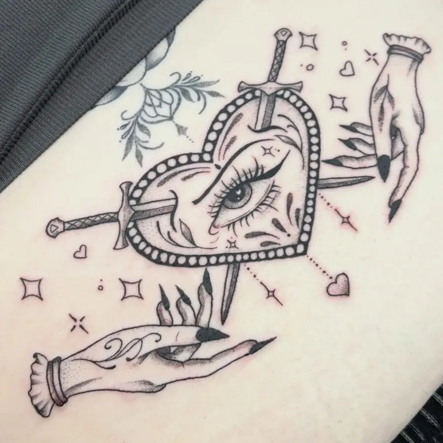 Intricate heart design with swords and hands