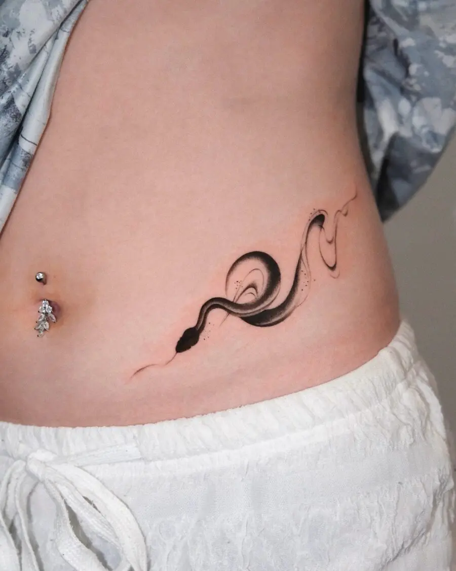 Sleek black snake tattoo flowing gracefully.