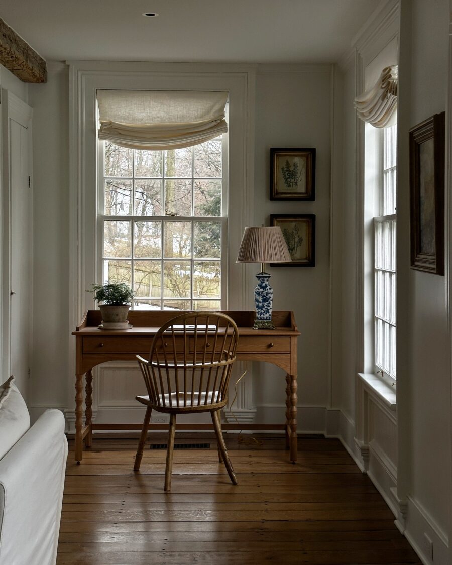 Brightly lit study desk with cozy accents