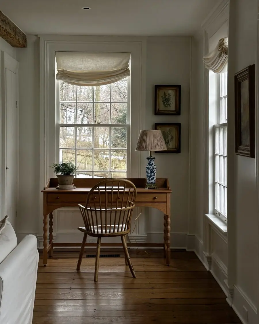Brightly lit study desk with cozy accents