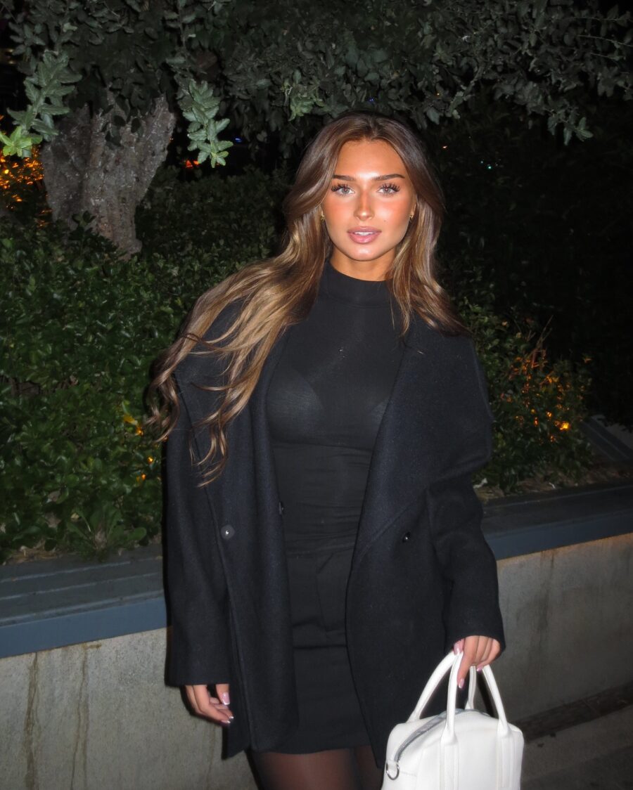 Chic black dress paired with a stylish coat