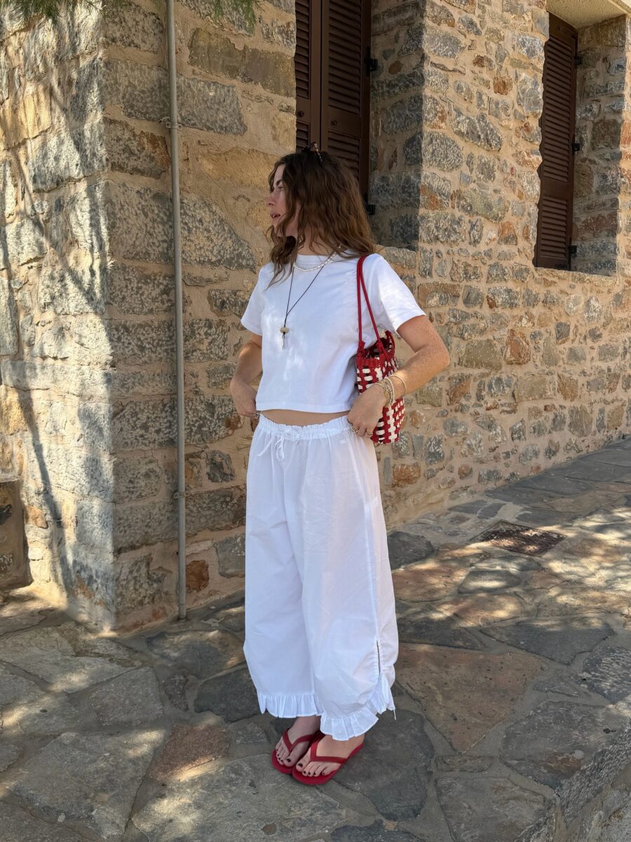 Chic white beach outfit with vibrant accents