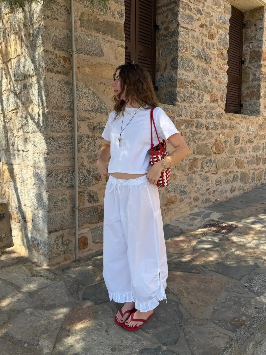 Chic white beach outfit with vibrant accents