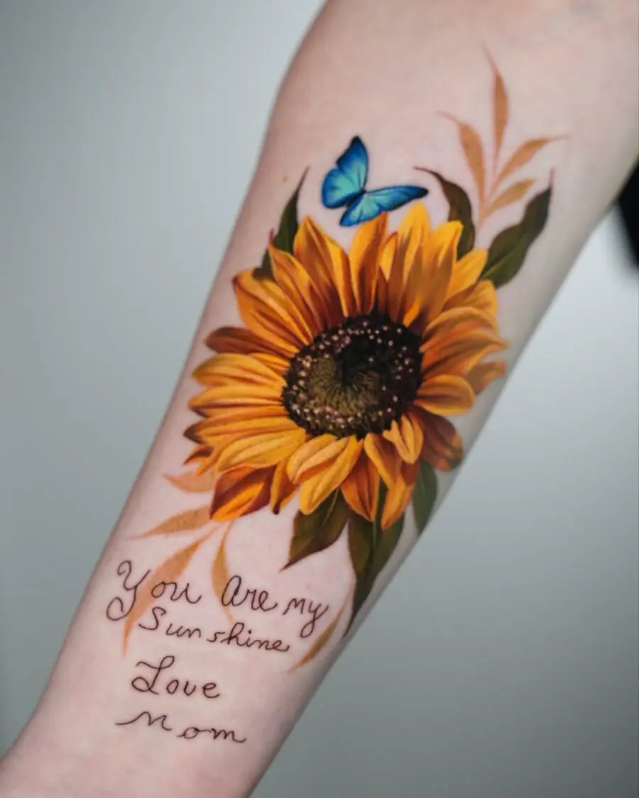 Beautiful sunflower tribute tattoo with butterfly