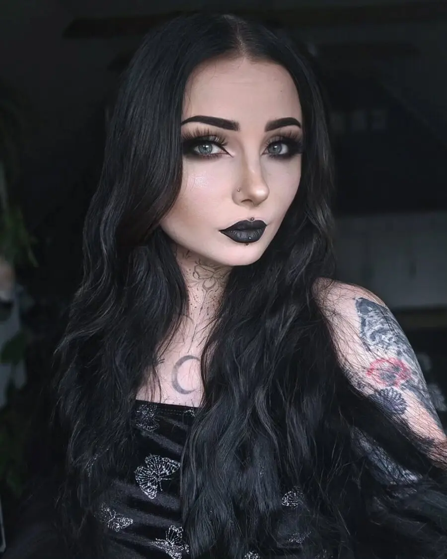 Bold black lips with striking eyeliner allure