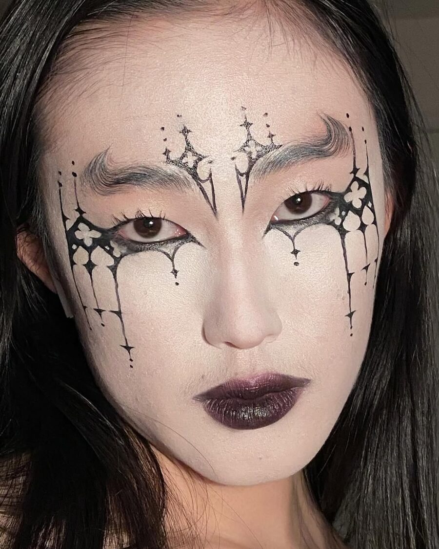 Dramatic gothic makeup with intricate detailing