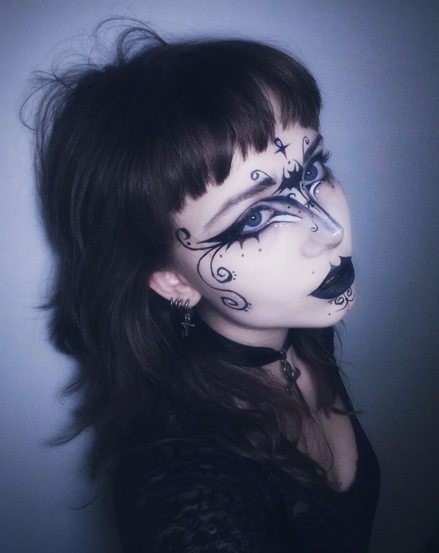 Intricate black and white goth makeup design