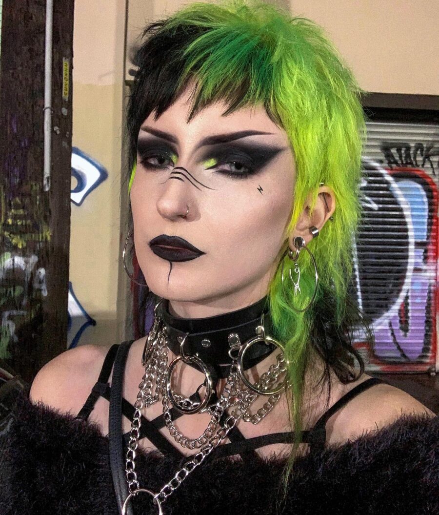 Bold green and black goth makeup style