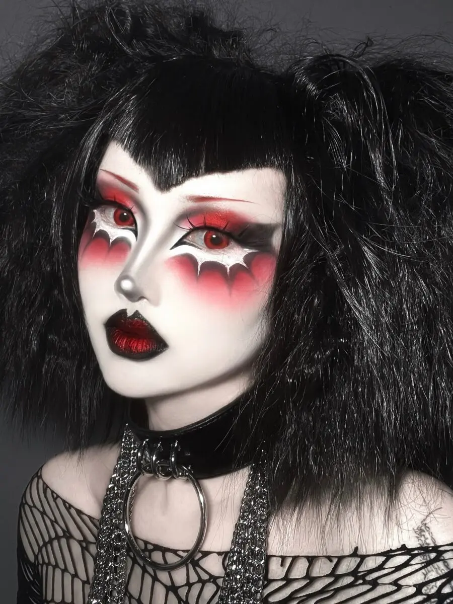 Dramatic red and black goth makeup style