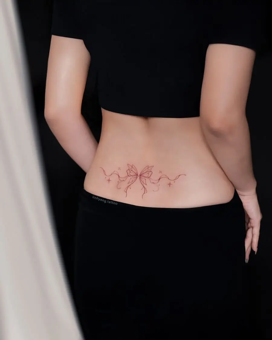 Elegant butterfly tramp stamp design in red ink