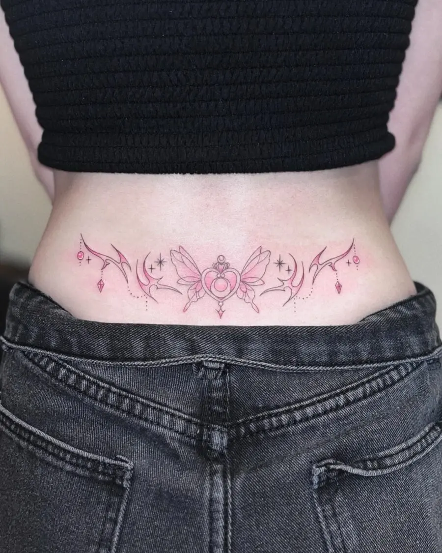 Delicate heart and wings tramp stamp tattoo