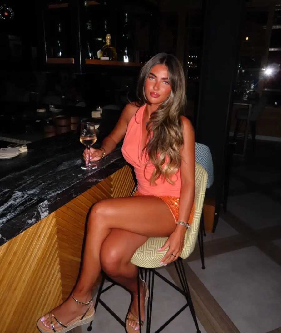 Glamorous orange club outfit with sparkling shorts