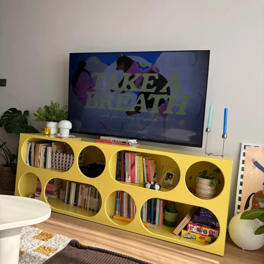 Vibrant yellow TV unit with stylish decor