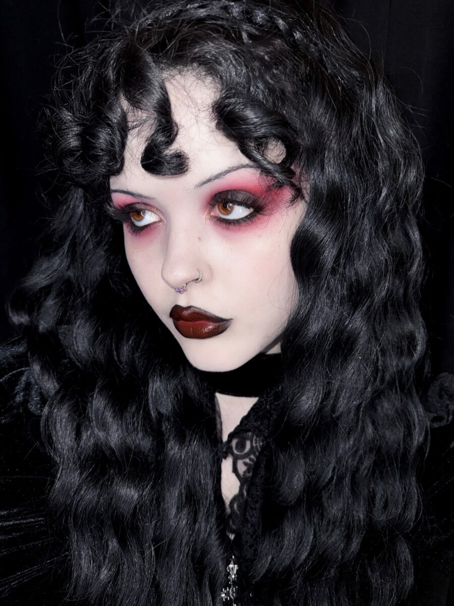 Gothic vampire look with striking red accents