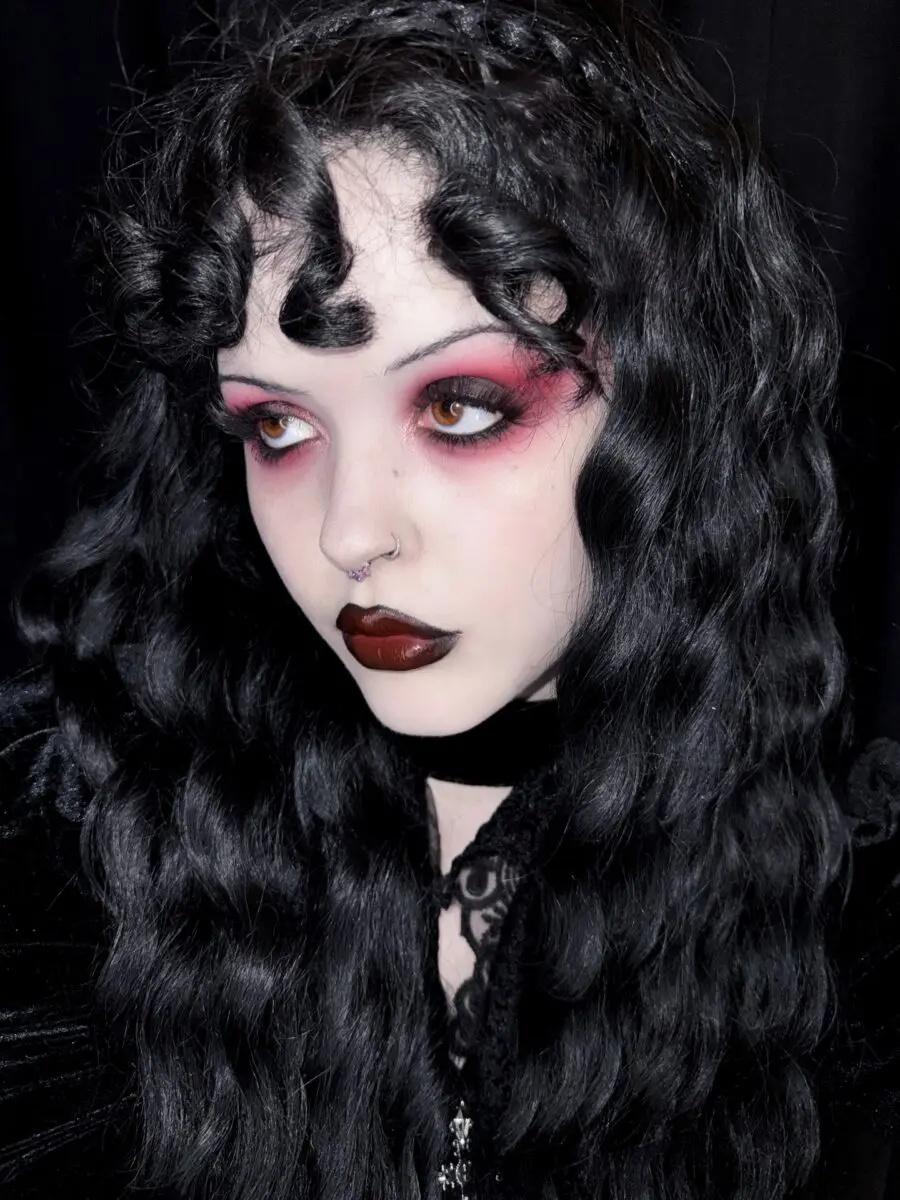 Gothic vampire look with striking red accents