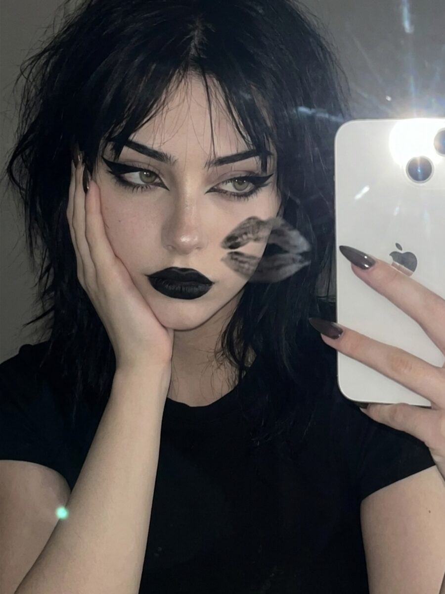 Edgy vampire makeup with bold black lips