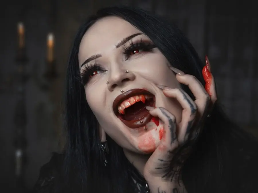 Glamorous vampire look with striking red accents
