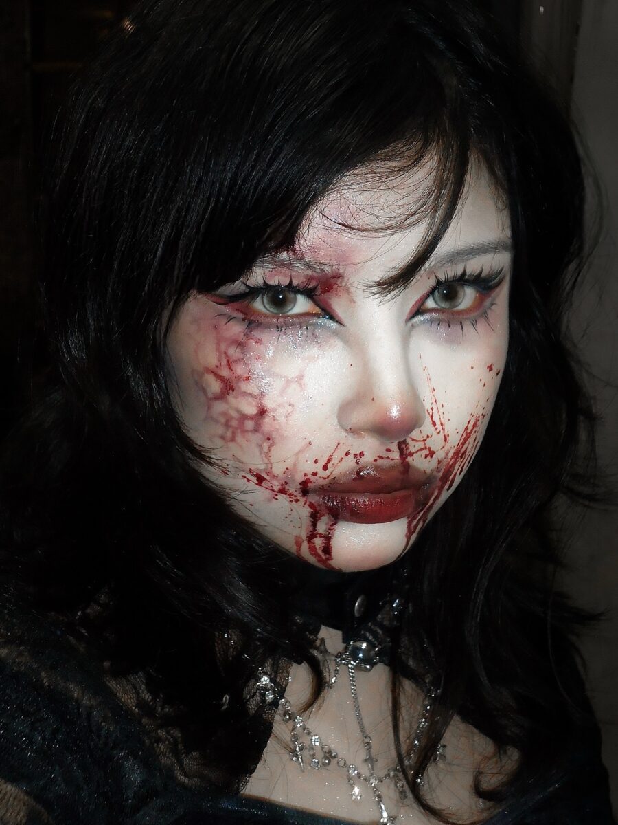 Dramatic bloodied vampire makeup for Halloween