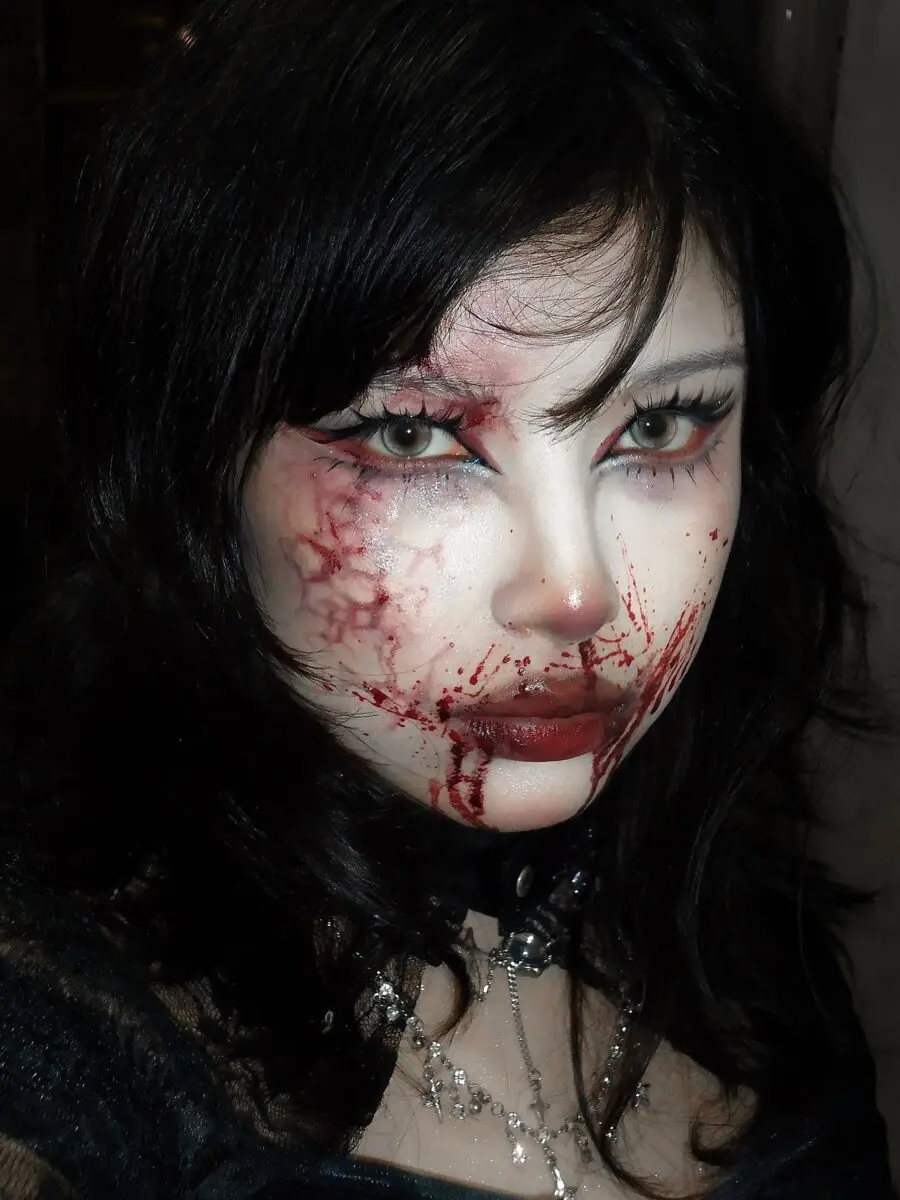 Dramatic bloodied vampire makeup for Halloween