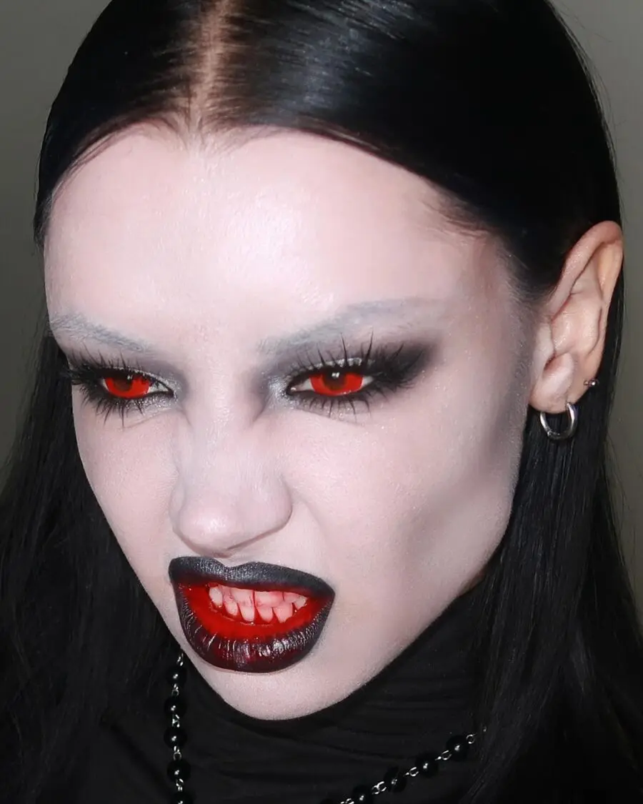 Bold vampire makeup with fierce red accents