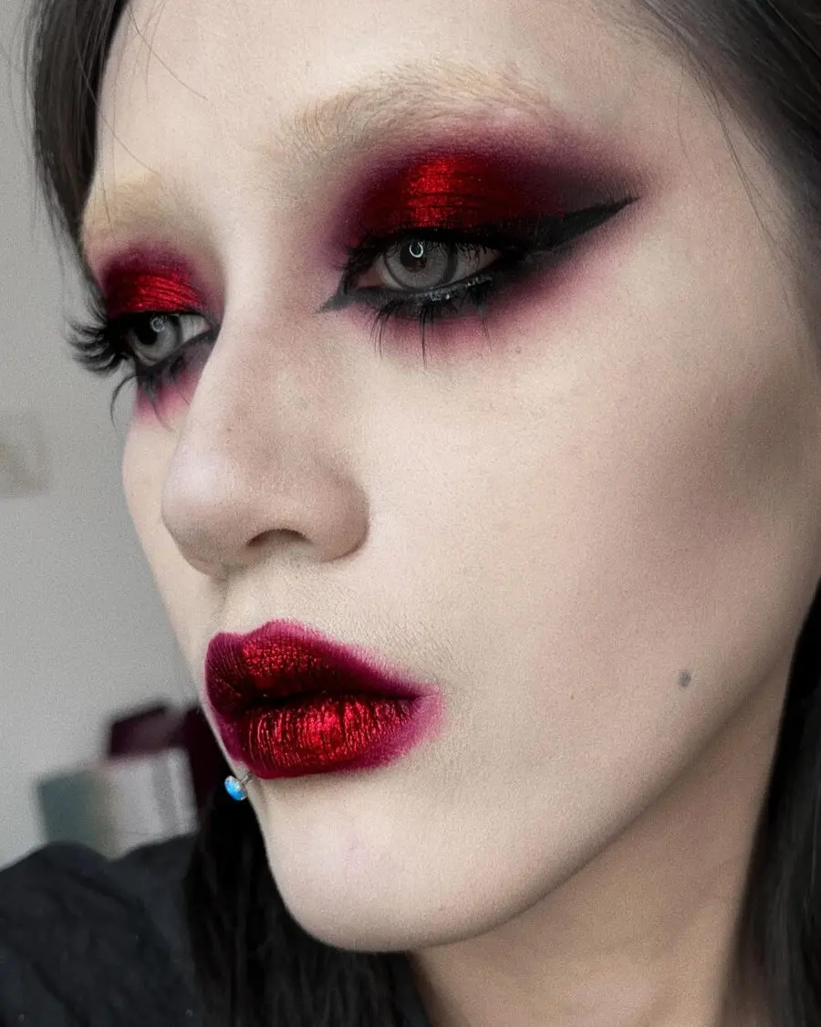 Dramatic vampire makeup with bold red accents
