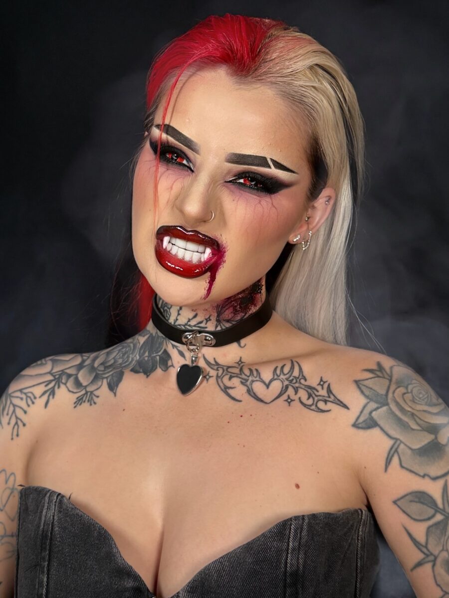 Striking vampire makeup with dramatic red lips