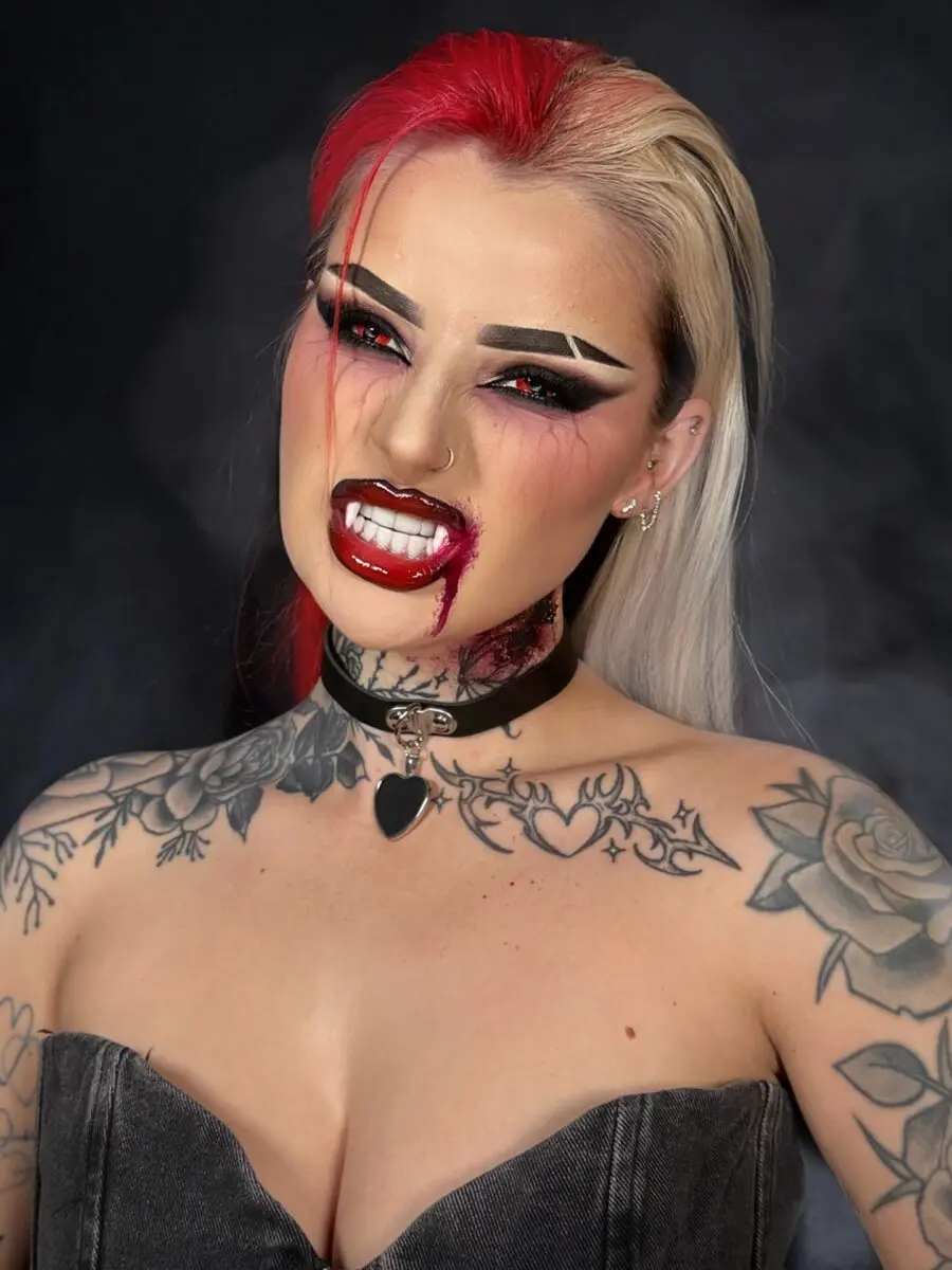Striking vampire makeup with dramatic red lips
