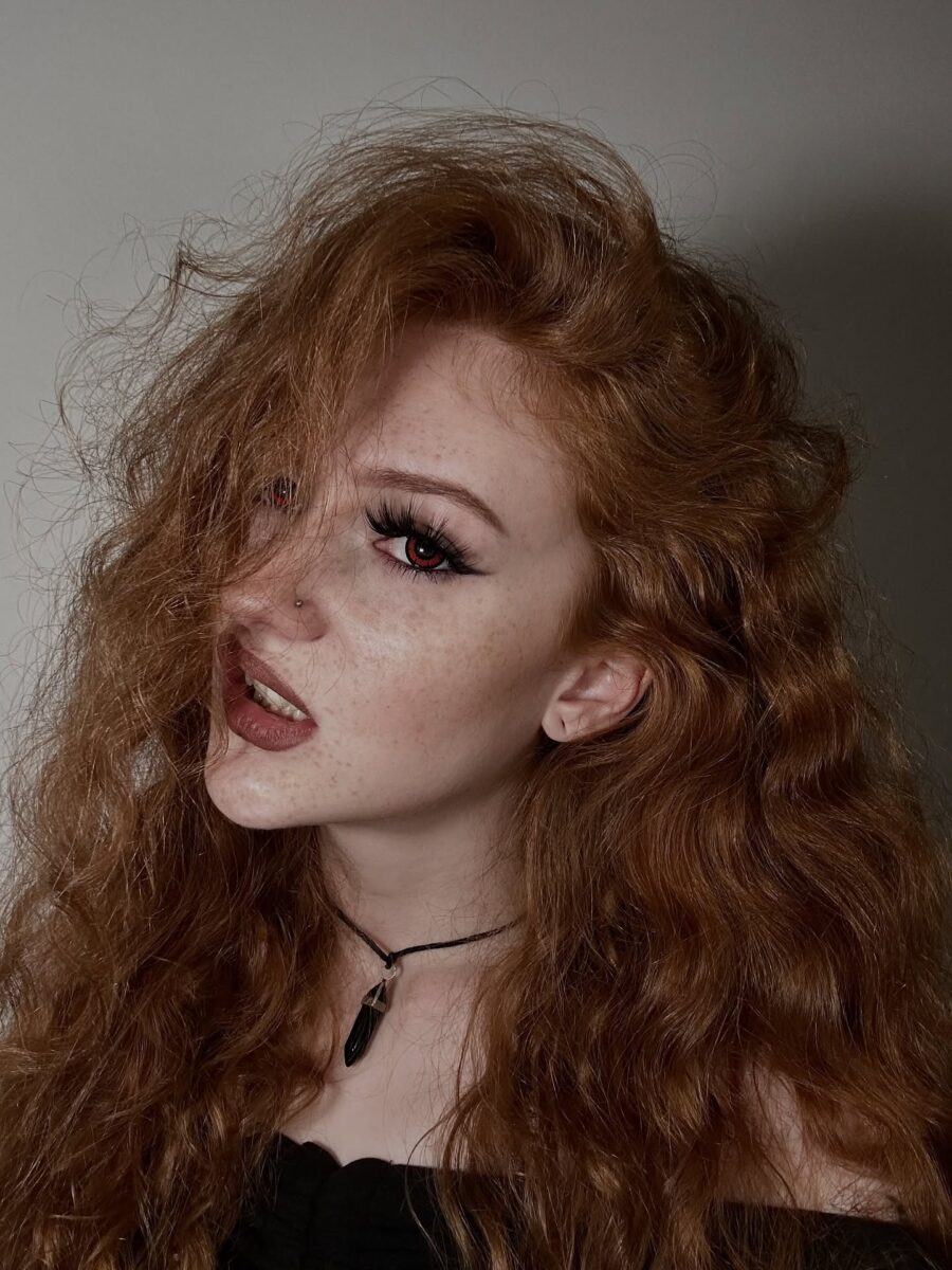 Dramatic vampire look with fiery red curls