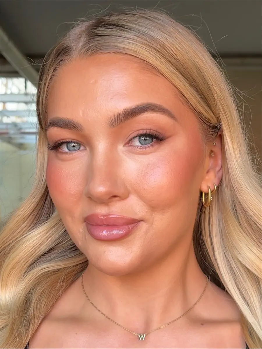 Radiant glow with soft blush and defined eyes