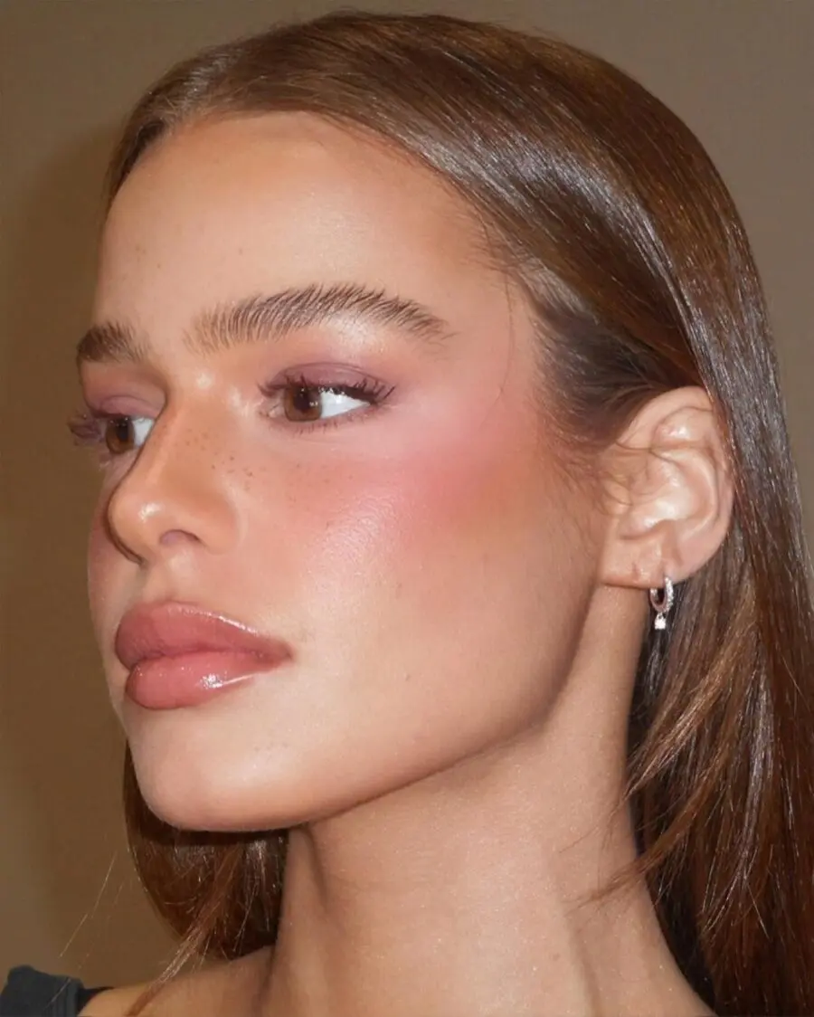 Glowing skin with rosy cheeks and glossy lips