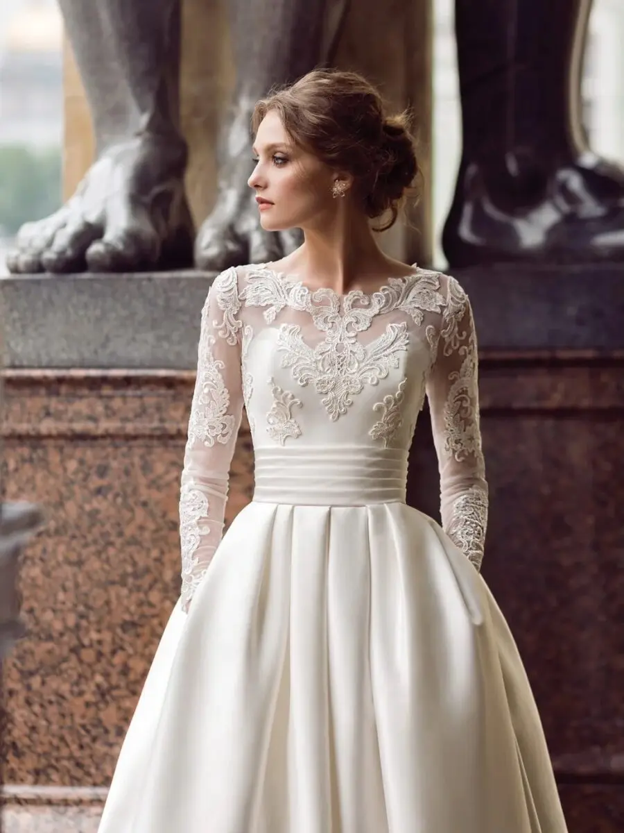 Stunning wedding dress with intricate lace sleeves