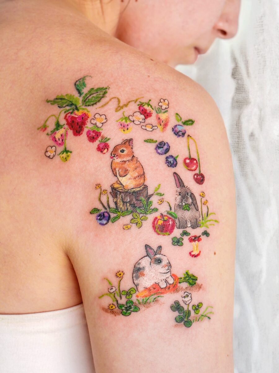 Charming animal and floral tattoo cluster