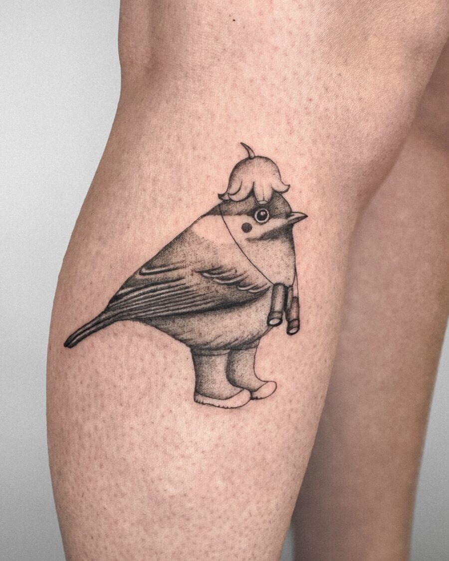 Playful bird tattoo with quirky character