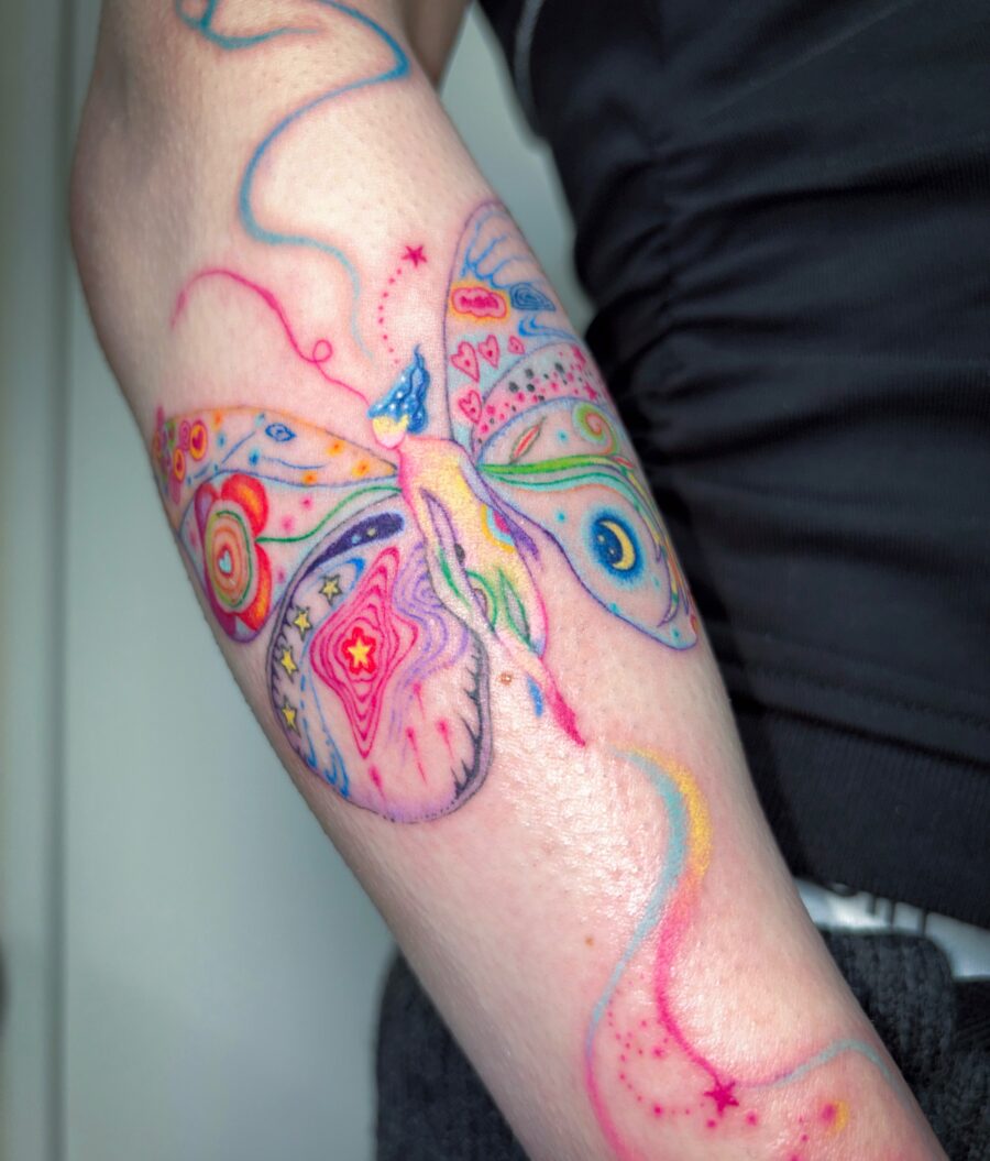 A vibrant butterfly tattoo bursting with creativity