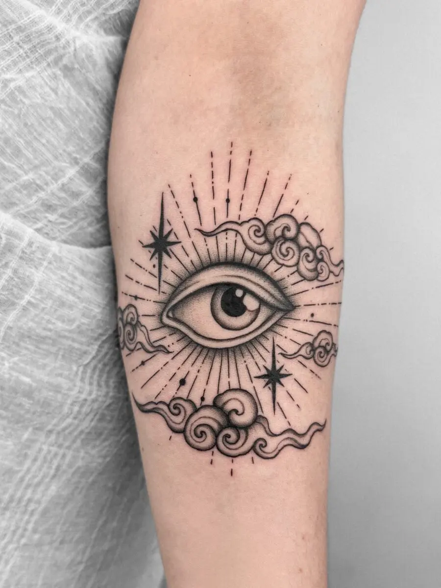 Whimsical Eye Tattoo Surrounded by Cosmic Elements