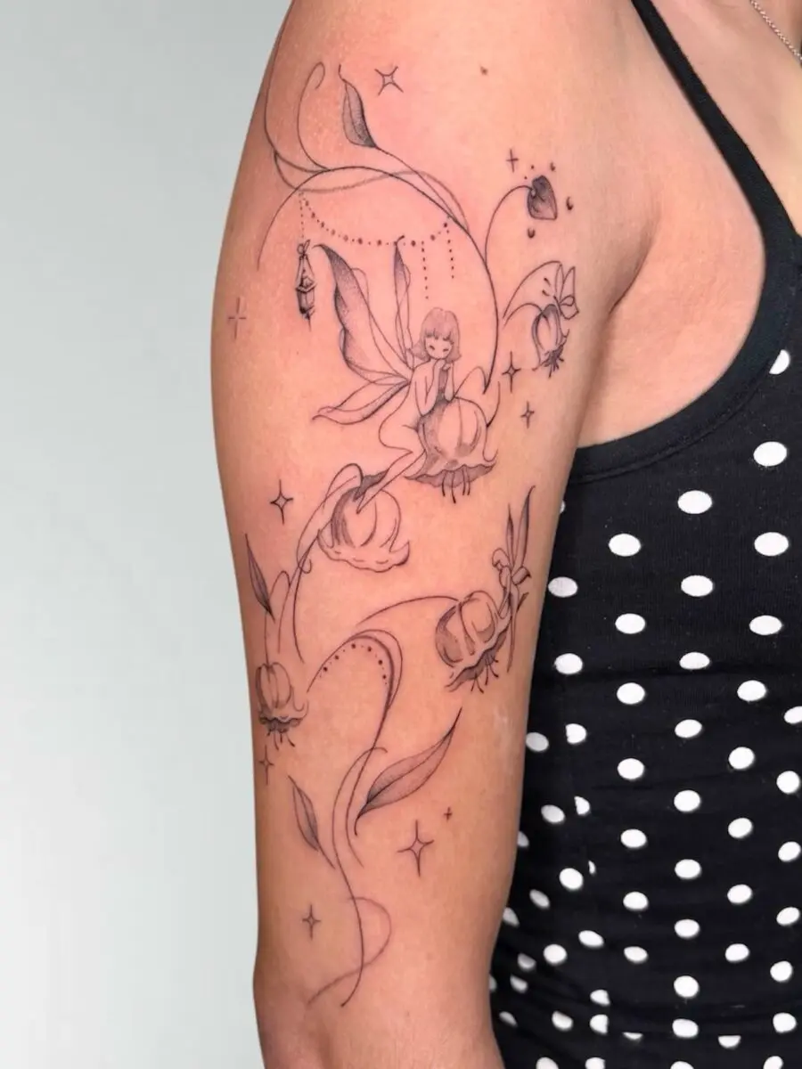 Charming fairy amid blooming flowers tattoo