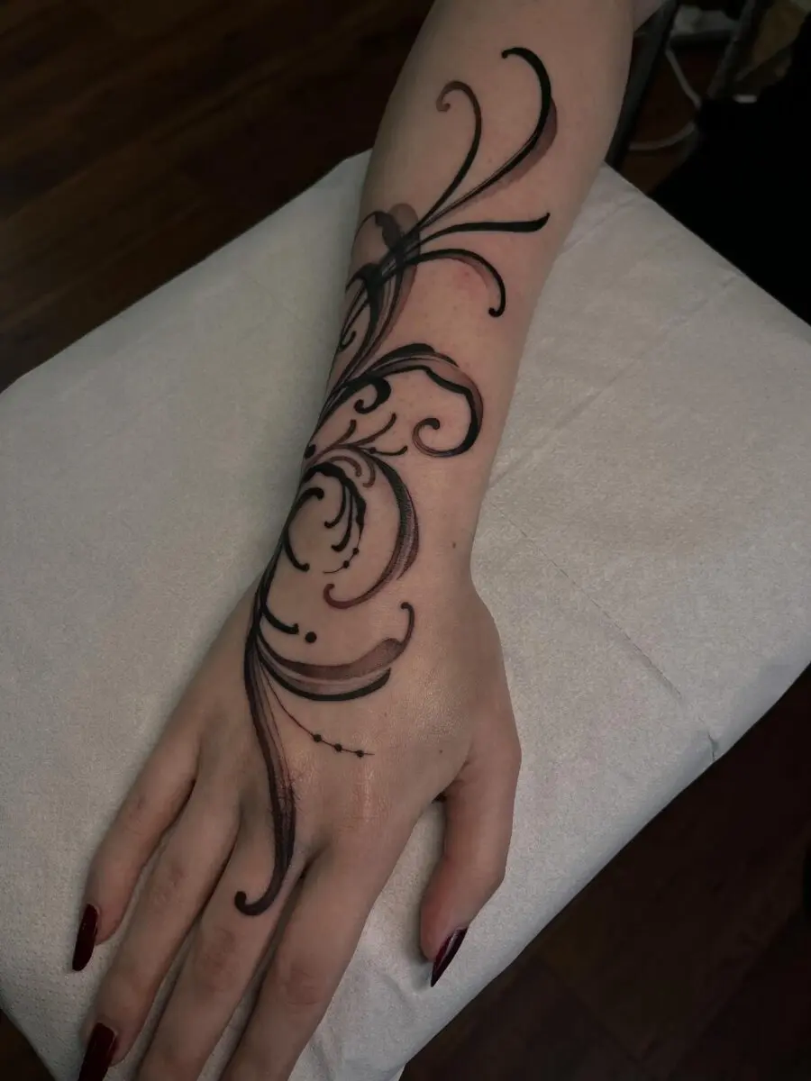 Intricate Floral Tattoo Design on the Arm