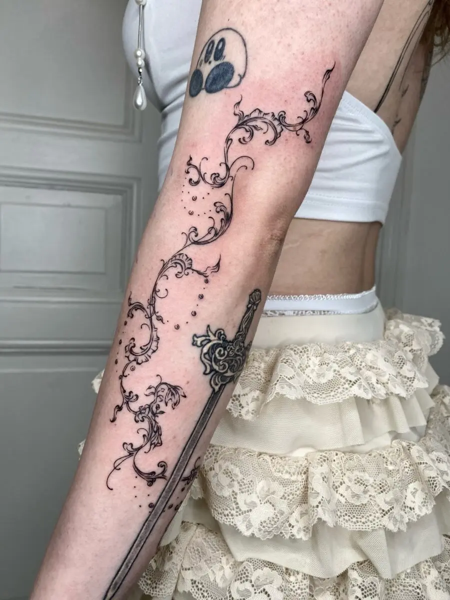 Intricate floral designs paired with a sword