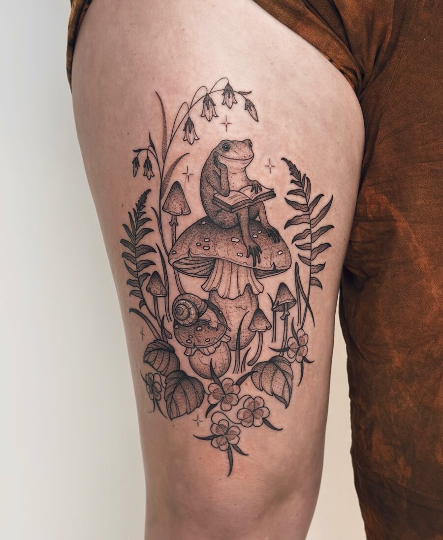 Nature-inspired whimsical tattoo design featuring a frog