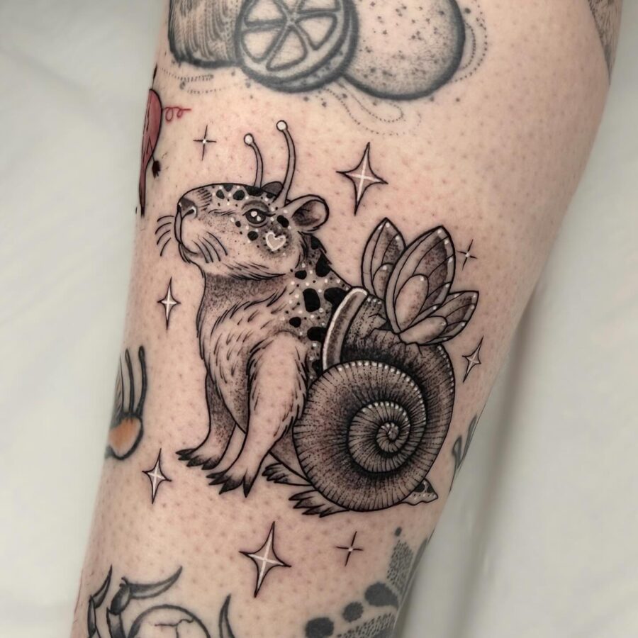 Quirky snail tattoo with charm and detail