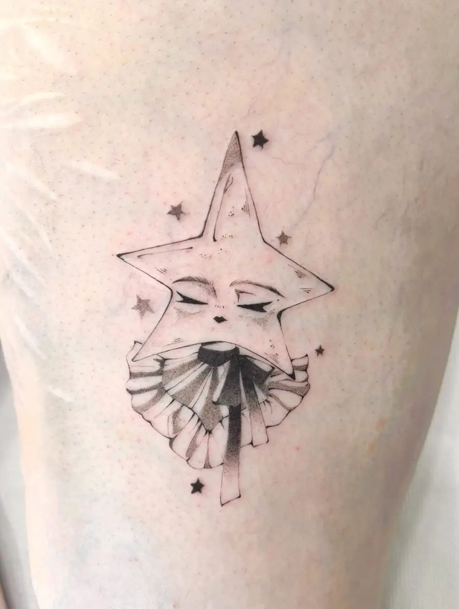 Enchanting whimsical star face tattoo
