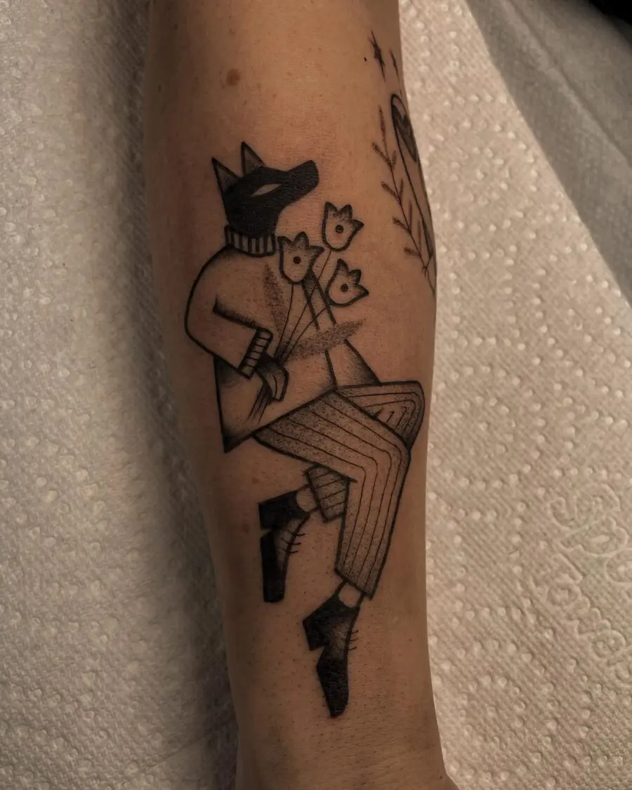 Whimsical animal tattoo with floral elements