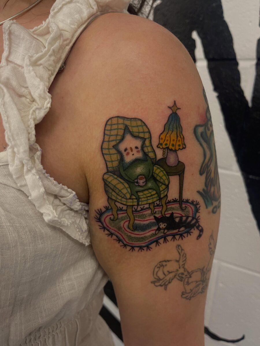 Charming gnome in a cozy chair tattoo