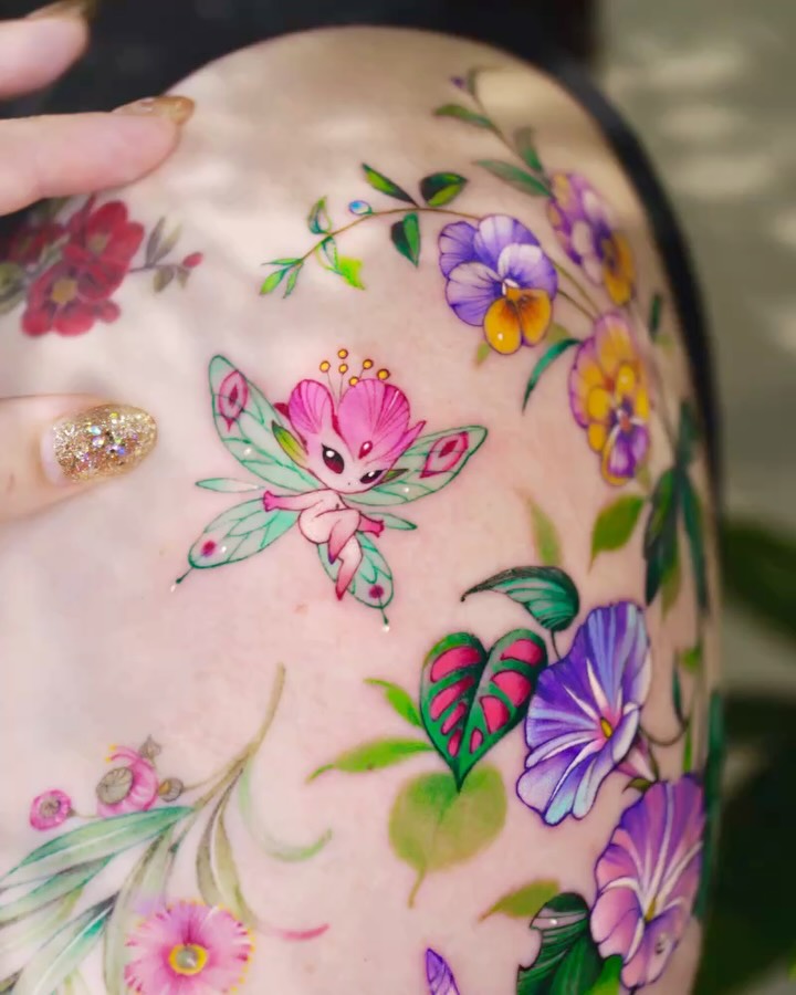 Enchanting and vibrant whimsical fairy tattoo