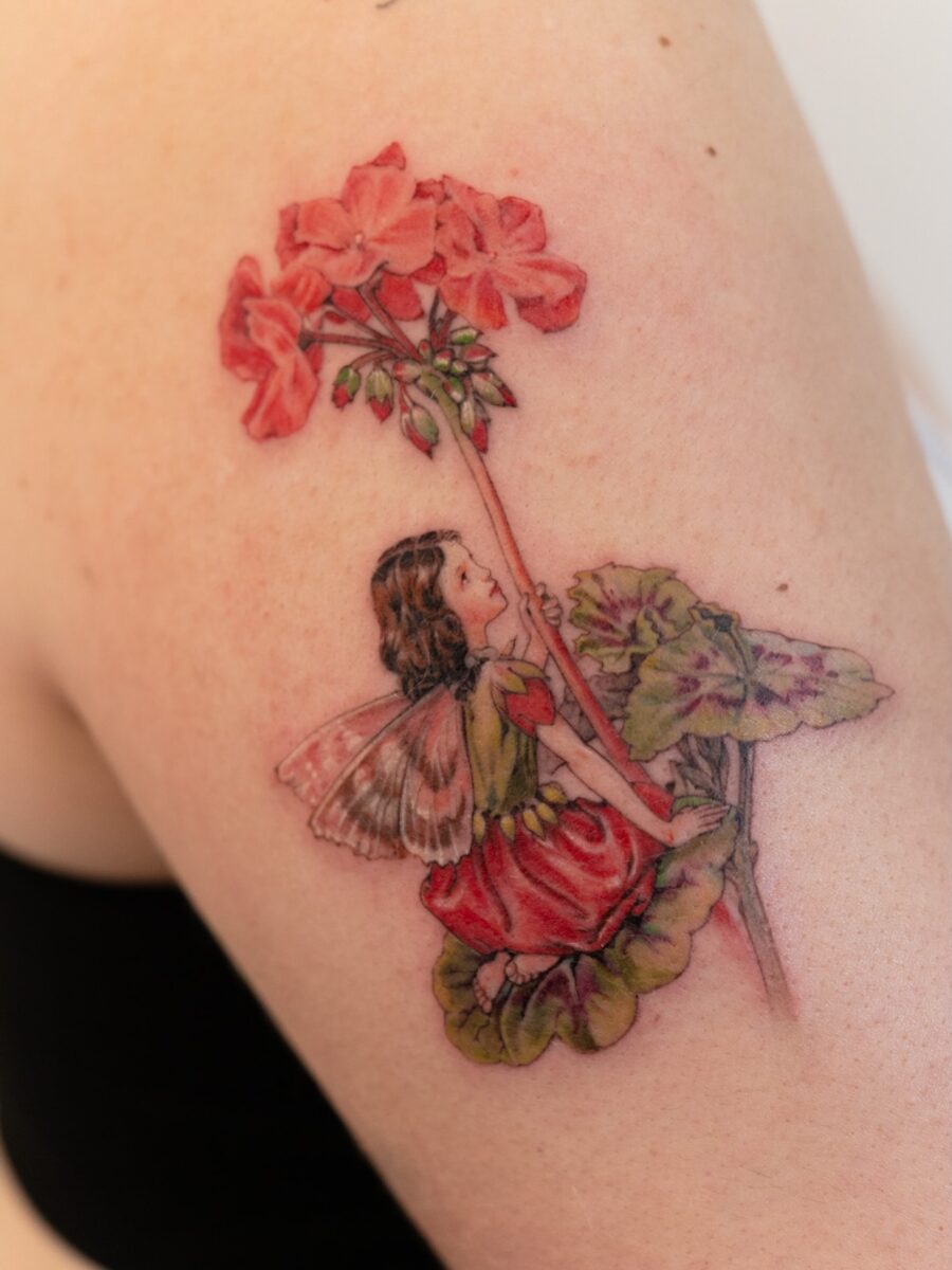 Delightful fairy and floral tattoo design